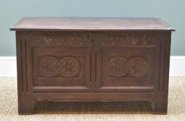 17TH CENTURY JOINED OAK COFFER, boarded and cleated top above panelled base with carved lunette