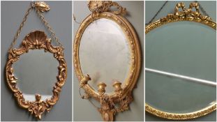 THREE VARIOUS GILT WALL MIRRORS, including Victorian oval girandole with scrolled swags and three