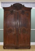 19TH CENTURY PROVINCIAL FRENCH OAK ARMOIRE, probably Normandy, carved C-scroll cornice with high