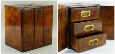 EARLY 19TH CENTURY BURR ELM TABLE CABINET, top with flush gilt brass handle, asymmetric doors with