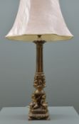 MODERN ITALIAN-STYLE CAST BRASS COLUMN TABLE LAMP with putti base, 56cms high