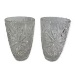 GLASSWARE - a near pair of heavy cut glass vases, 25cms tall