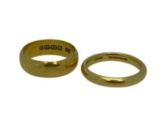 VICTORIAN 22CT GOLD WEDDING BANDS (2) - the wider band ring dated 1899, the other 1860, size Mid N-