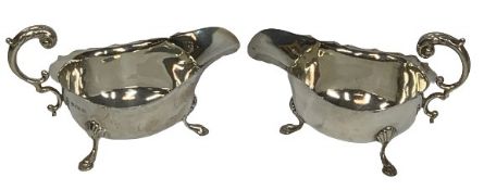 SILVER SAUCE BOATS, A PAIR - Birmingham 1939 and 1940 having 'C' scroll handles on three hoof