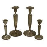 SILVER CANDLESTICKS, 2 PAIRS - the taller pair marked 'Sterling', 23cm heights, 17.7 ozt, the
