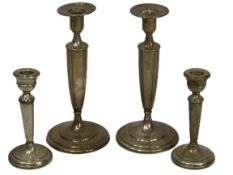 SILVER CANDLESTICKS, 2 PAIRS - the taller pair marked 'Sterling', 23cm heights, 17.7 ozt, the