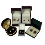 THREE PAIRS OF 9CT GOLD EARRINGS and two pairs of silver earrings, all boxed