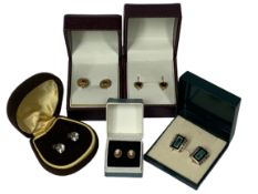THREE PAIRS OF 9CT GOLD EARRINGS and two pairs of silver earrings, all boxed