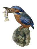 NEIL DALRYMPLE CERAMIC SCULPTURE OF A KINGFISHER WITH CATCH - standing on a rocky mount, incised