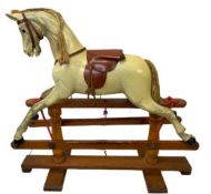 VICTORIAN CARVED WOOD & PAINTED ROCKING HORSE, possibly G & J Lines, with leather saddle on a