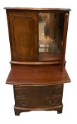 COCKTAIL CABINET - reproduction mahogany effect with mirrored interior and central slider, 131cms H,