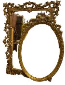 MIRRORS - an oval bevelled glass decorative mirror, 106 x 74cms and another faux antique example, 50