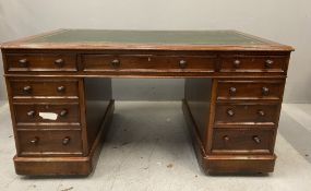 VICTORIAN MAHOGANY TWIN PEDESTAL DESK with green gilt tooled skiver, nine drawers with turned wooden