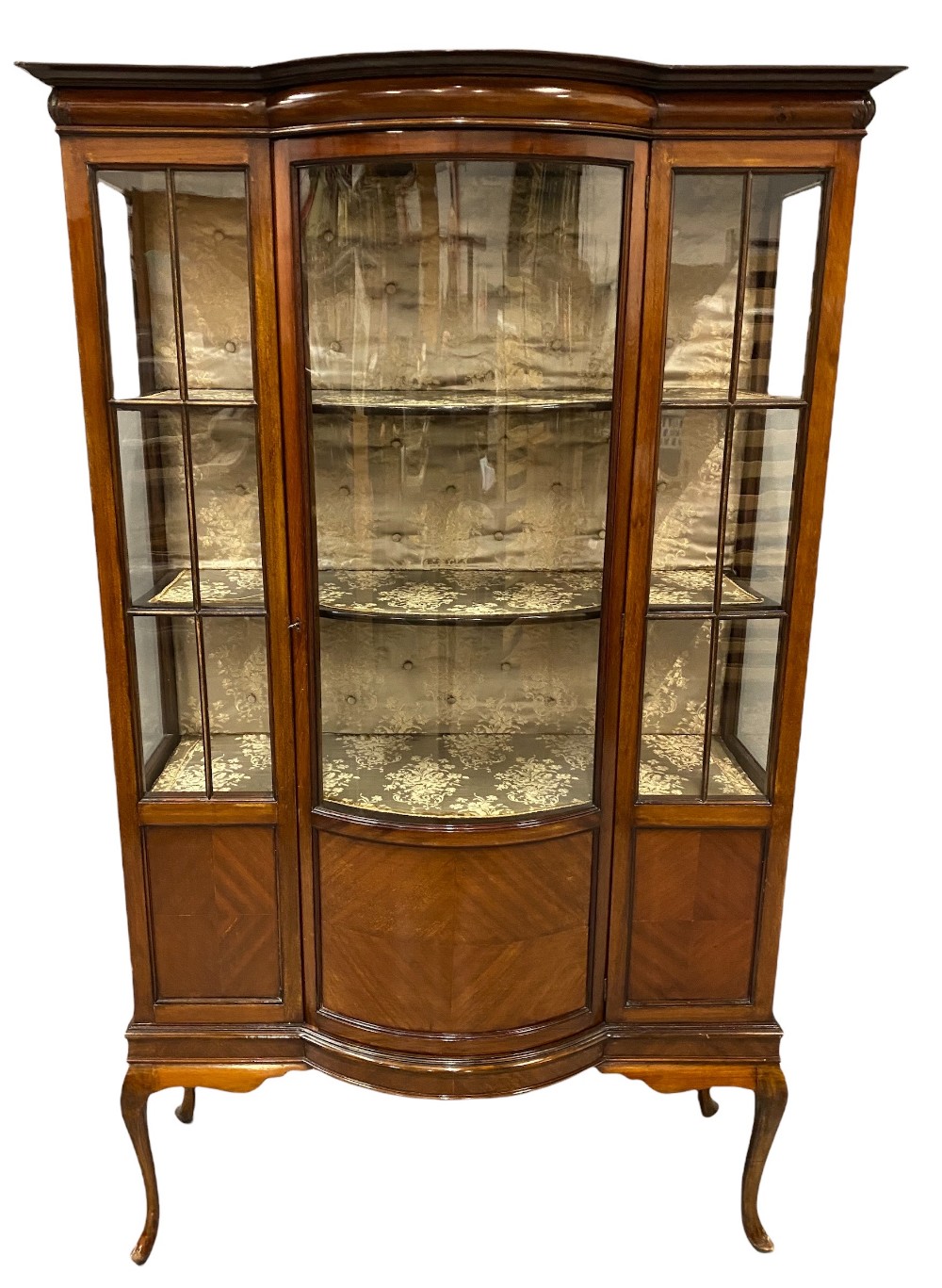 QUALITY EDWARDIAN MAHOGANY CHINA CABINET with single door and bow front on splayed supports,