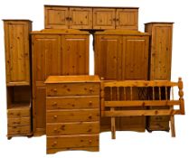 MODERN PINE BEDROOM FURNITURE comprising a pair of two door wardrobes, 187cms H, 100cms W, 53cms D