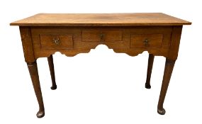 ANTIQUE OAK THREE DRAWER LOWBOY with shaped apron on pad feet, 71cms H, 105cms W, 50cms D