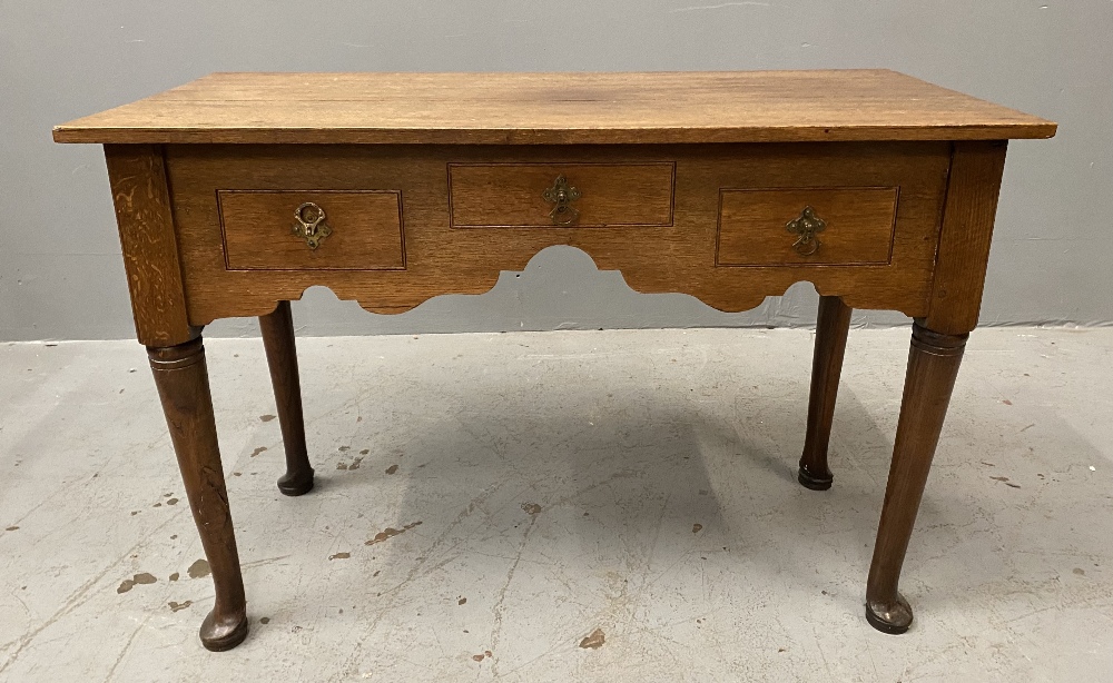 ANTIQUE OAK THREE DRAWER LOWBOY with shaped apron on pad feet, 71cms H, 105cms W, 50cms D - Image 2 of 4
