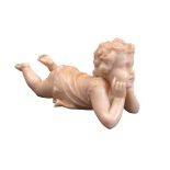 VICTORIAN CARVED IVORY FIGURINE OF A CHILD - depicted lying on its stomach with its head supported