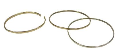 9CT GOLD LADY'S BANGLES (2) - a solid example stamped '375' (cut) and a dual foldover hollow core,