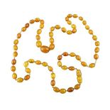 BALTIC AMBER NECKLACE - of graduated oval beads, 80cms L, 24.5grms
