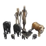 AFRICAN WOOD CARVINGS - a quantity including a rhinoceros, ebony elephants and two standing