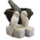 GRANITE TYPE PESTLE & MORTAR and a pair of carved alabaster parrot bookends, 14.5cm heights