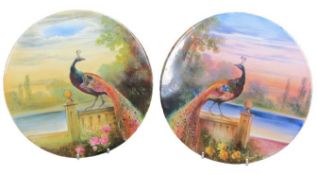 WILLIAM BIRBECK HAND PAINTED PORCELAIN PLAQUES (2) depicting opposing peacocks with variant