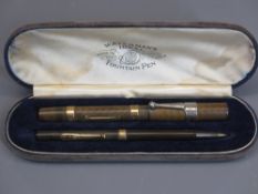 CASED WATERMAN'S IDEAL FOUNTAIN PEN & PROPELLING PENCIL SET - having 9ct gold marked collars, the