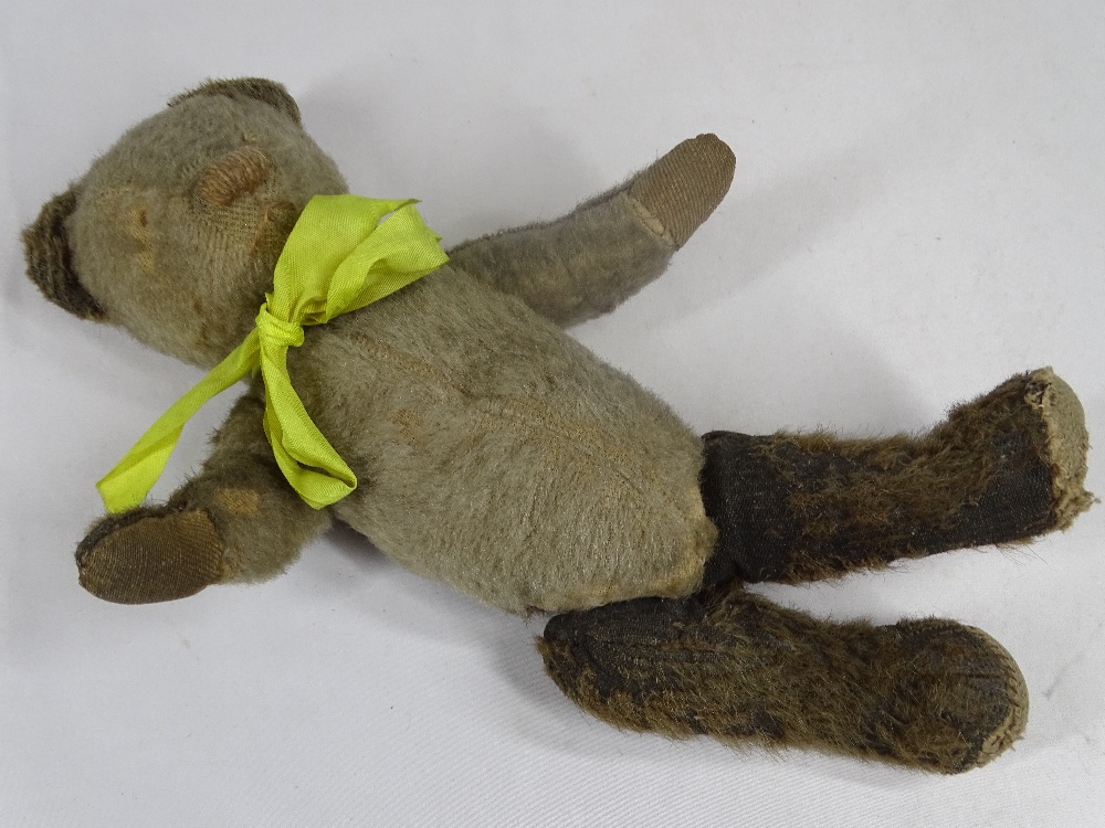VINTAGE JOINTED TEDDY BEAR - with yellow ribbon, 26cms L in well-loved playworn condition - Image 2 of 2