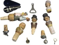 DRINKS COLLECTABLES - to include carved figural and white metal bottle corkers, cased champagne tap,