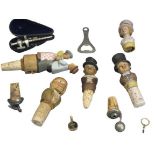 DRINKS COLLECTABLES - to include carved figural and white metal bottle corkers, cased champagne tap,