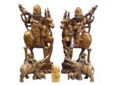 CHINESE/JAPANESE CARVED WOODEN FIGURINES including a tall pair of bearded men riding deer, 43cms