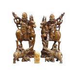 CHINESE/JAPANESE CARVED WOODEN FIGURINES including a tall pair of bearded men riding deer, 43cms