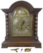 JUNGHANS OAK CASED MANTEL CLOCK - tempus fugit arched top dial set with Roman numerals before a