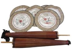 CHINESE PAPER PARASOLS (2) and a set of 6 needlework silk circular placemats