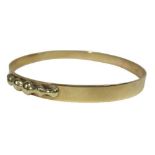 9CT GOLD LADY'S BANGLE - solid with part edge applied decoration, 17.2grms