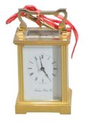 BRASS CASED CARRIAGE CLOCK - the dial marked London Clock Company with winding key, 14cms H handle