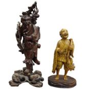 CHINESE & JAPANESE CARVED WOODEN FIGURINES - the Japanese example depicting a fisherman with