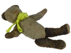 VINTAGE JOINTED TEDDY BEAR - with yellow ribbon, 26cms L in well-loved playworn condition