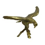 LARGE BRASS ORNAMENTAL EAGLE - modelled with open wings perched on a branch, 51cms overall H,