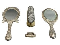 SILVER DRESSING TABLE ITEMS, 4 PIECES to include an embossed hand mirror, Birmingham 1896, Arthur