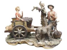 LARGE CAPODIMONTE PORCELAIN GROUP of a man and young boy with donkey and cart gathering grapes on