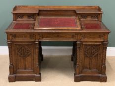VICTORIAN GOTHIC REVIVAL DESK with tooled leather effect top and sloped centre section, twin