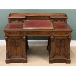 VICTORIAN GOTHIC REVIVAL DESK with tooled leather effect top and sloped centre section, twin