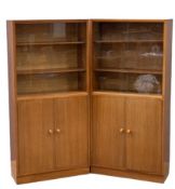 PAIR OF MID-CENTURY BOOKCASES with upper sliding glass doors over two cupboard doors, 145cms H,