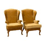 VINTAGE WING BACKED ARMCHAIRS, a pair, in mustard coloured upholstery, 102cms H, 75cms W, 50cms D