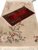 CHINESE WASHED RUG with floral pattern, 222 x 122cms and a G H Ffrith red carpet runner, 105 x