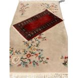 CHINESE WASHED RUG with floral pattern, 222 x 122cms and a G H Ffrith red carpet runner, 105 x