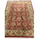 G H FFRITH LTD WOOLLEN RUG, red border with floral pattern, 192 x 122cms