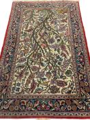 IRANIAN RUG with exotic bird and tree design having a multi-pattern border, 210 x 135cms